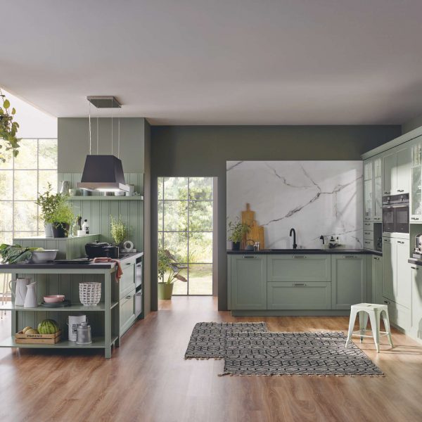 a kitchen with green cabinets